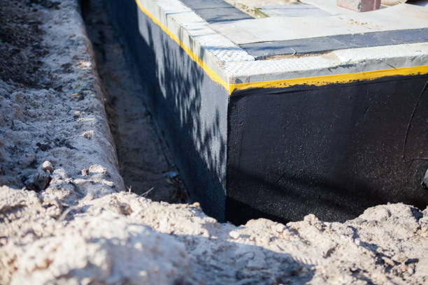 Professional Waterproofing technician working in Bon Secour, AL